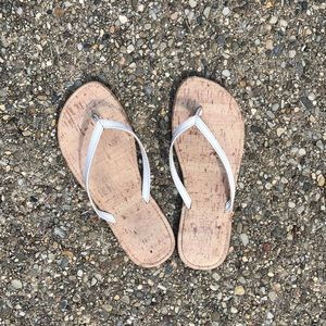 White beachy flip flops